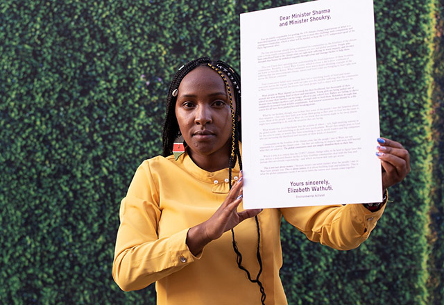 Environmentalist and climate activist Elizabeth Wathuti at COP27, holding her letter to climate leaders.